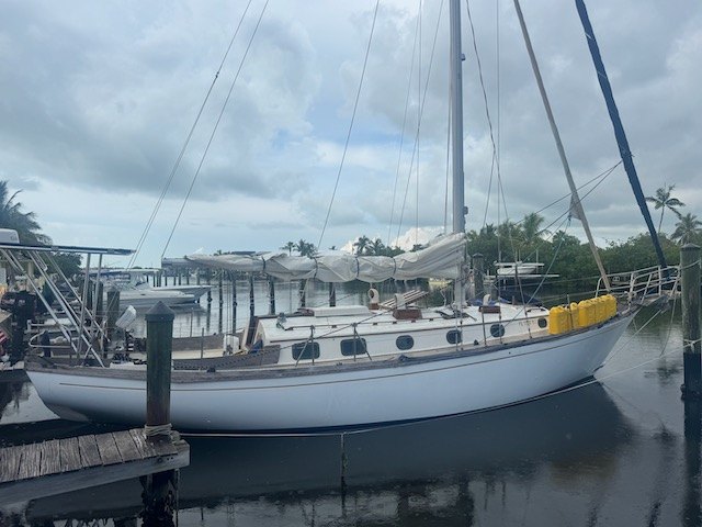 Yemaya, a white Shannon 38 cutter, tied up at her dock